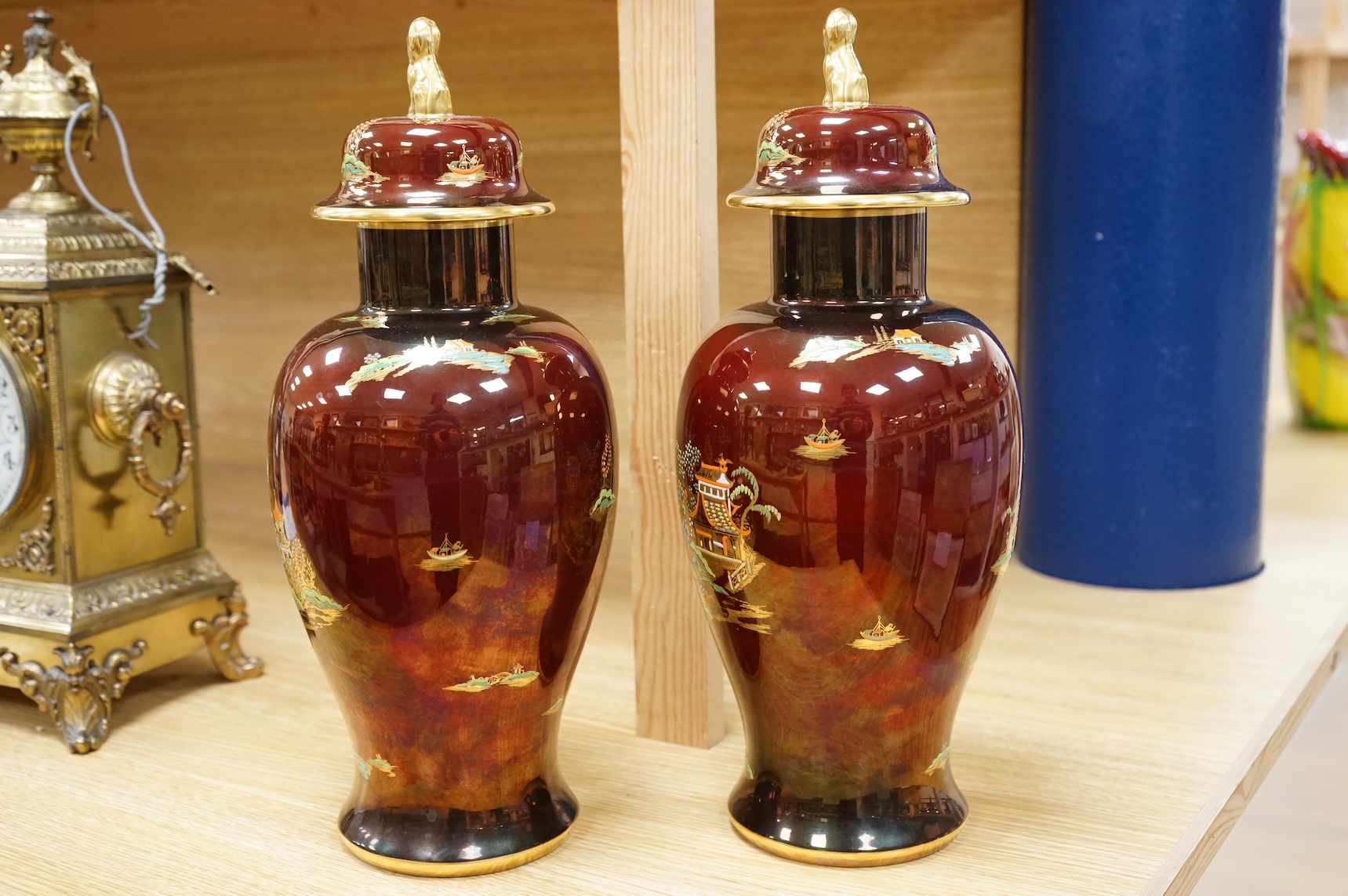 A pair of Carlton Ware Rouge Royale lustre vases and covers with chinoiserie decoration, 38cm high